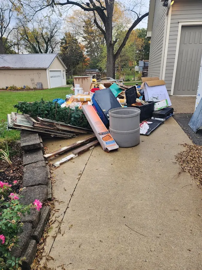 Dumpster being loaded with debris for 3 Yard Dumpster Rental in Wayne
